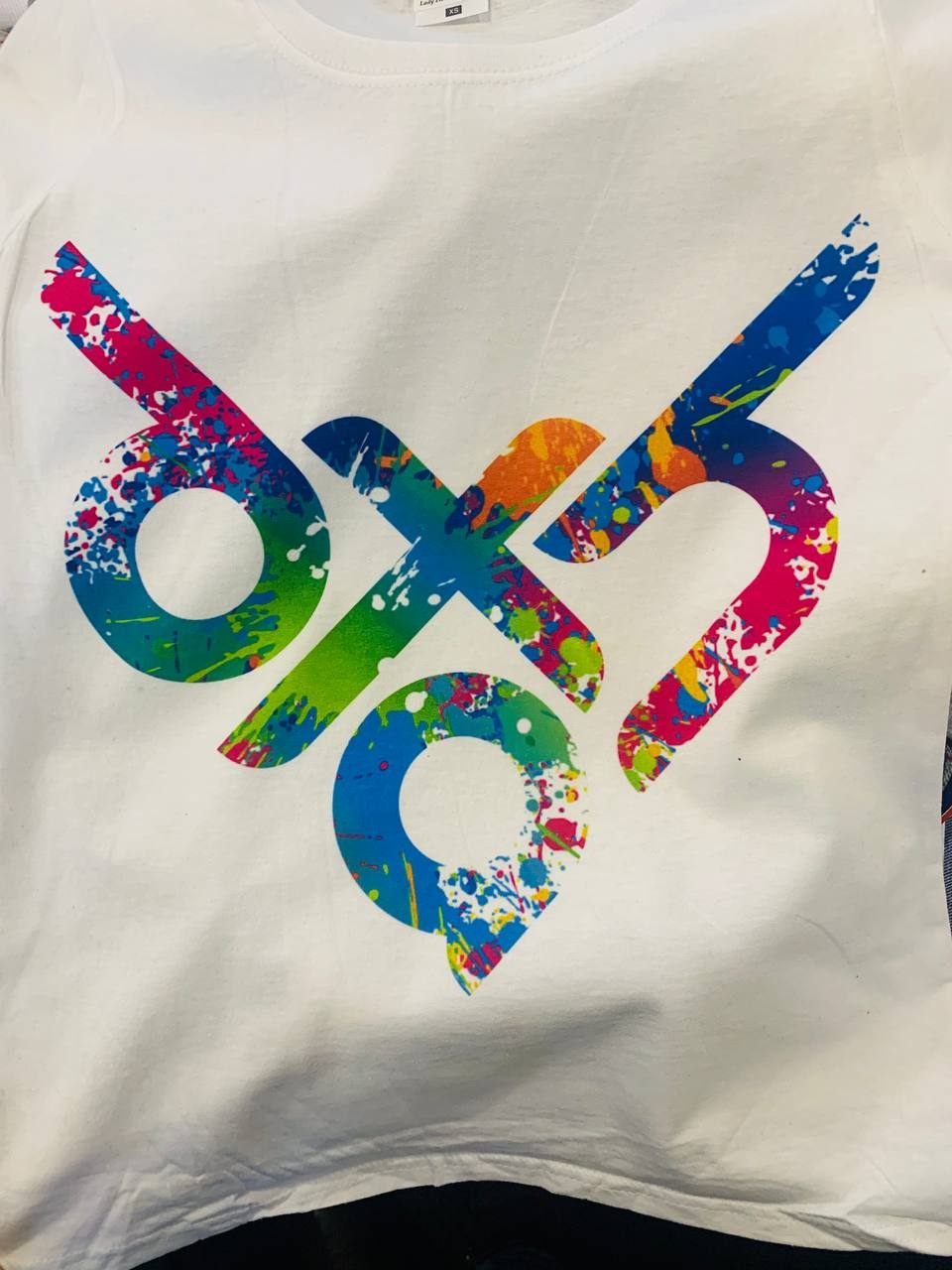 Colorful paint-splatter custom print on white tee