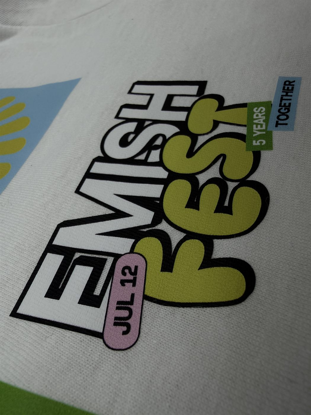 Colorful festival merch print on white tee