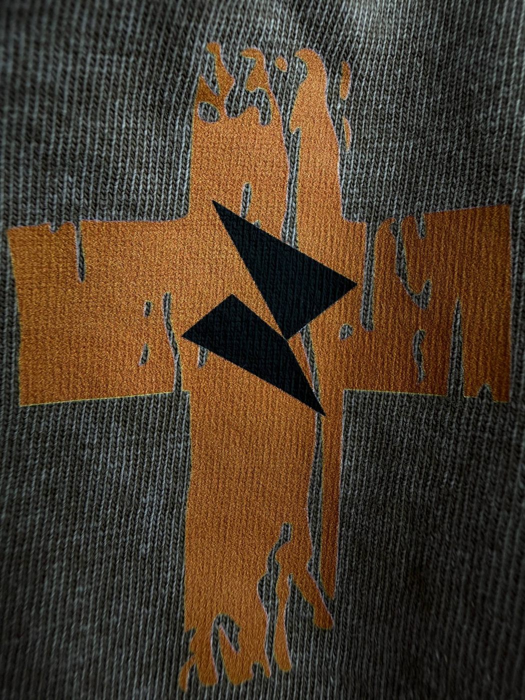 Distressed two-tone print on washed grey knit