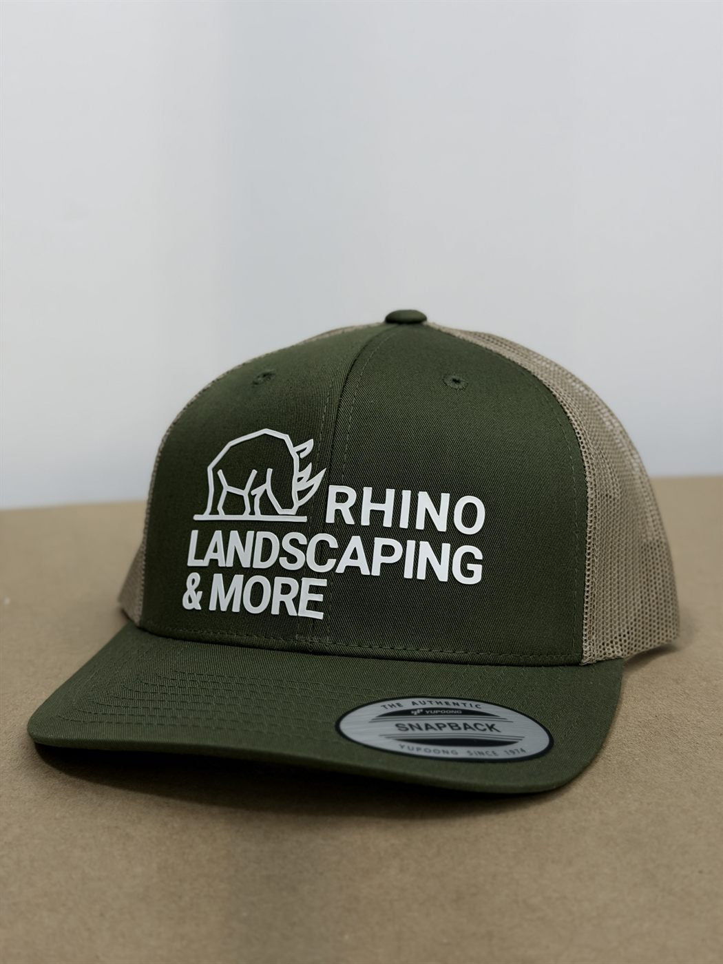 Embroidered olive trucker cap — Rhino Landscaping