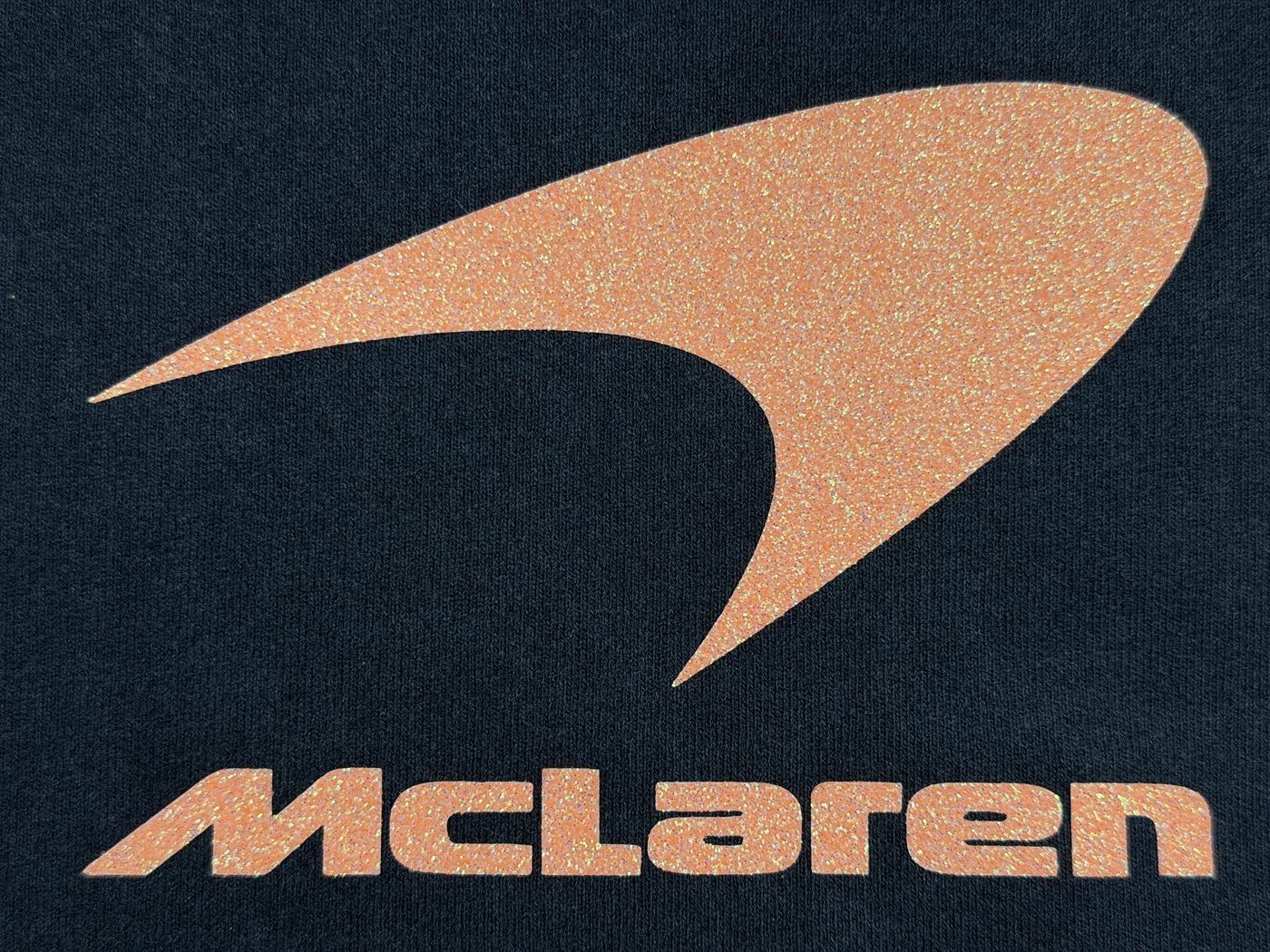 Metallic copper logo print on navy