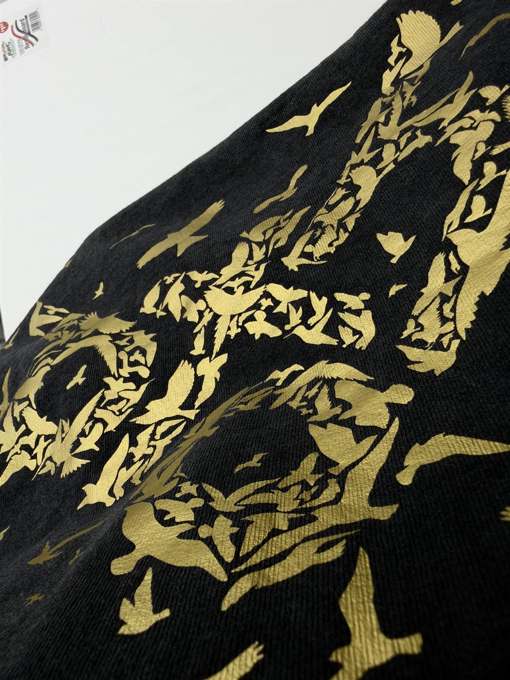 Macro of metallic gold vinyl detail on black